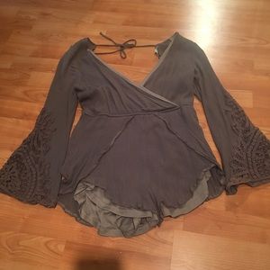 Green bell sleeve romper with lace detailing